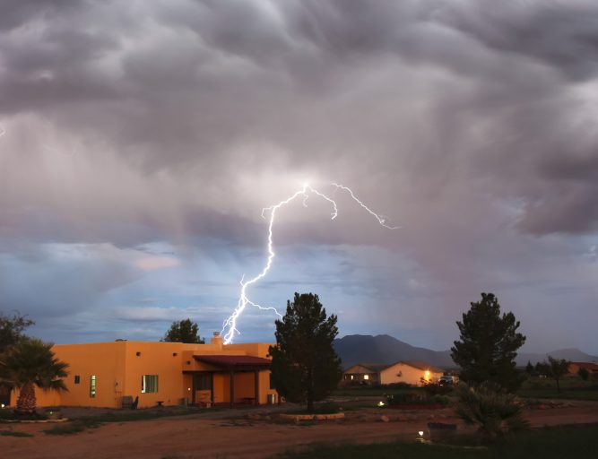 Hereford, Arizona - August 16, 2014: Palominas, Arizona, near Hereford, Arizona. A Bolt of Lightning Strikes in a Rural Arizona Neighborhood