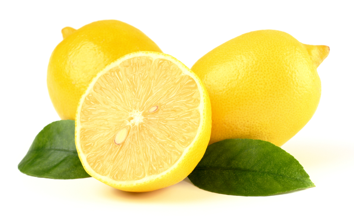 Group of lemons with leaves, isolated over white
