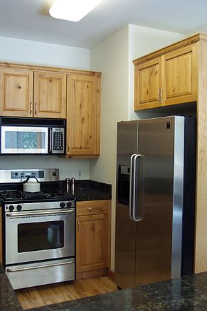 A small, modern kitchen with popular stainless... A small, modern kitchen with popular stainless...