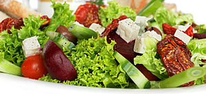 A garden salad with lettuce, sundried tomatoes... A garden salad with lettuce, sundried tomatoes...