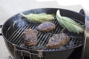 Beef and Corn on a Charcoal BBQ grill Beef and Corn on a Charcoal BBQ grill
