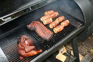 Some chicken, pork and corn in the barbeque Some chicken, pork and corn in the barbeque