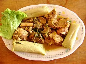Español: Cabrito con tamales. Piura, Perú. Español: Cabrito con tamales. Piura, Perú.