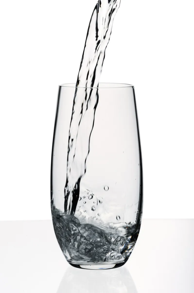 Glass with a water, isolated on a white background.
