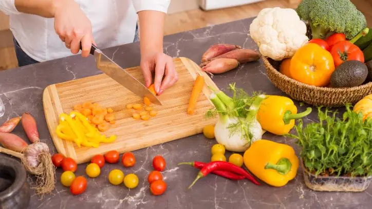 Person cutting vegetables