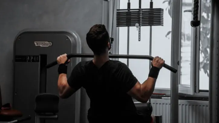 Man lifting weights at the gym