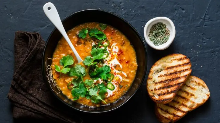 Bowl of Soup and Slices of Bread