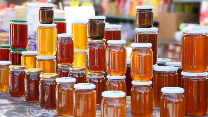 Several jars of honey at a Farmer's Market