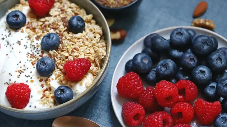 Overnight Oats in a bowl with berries next to it