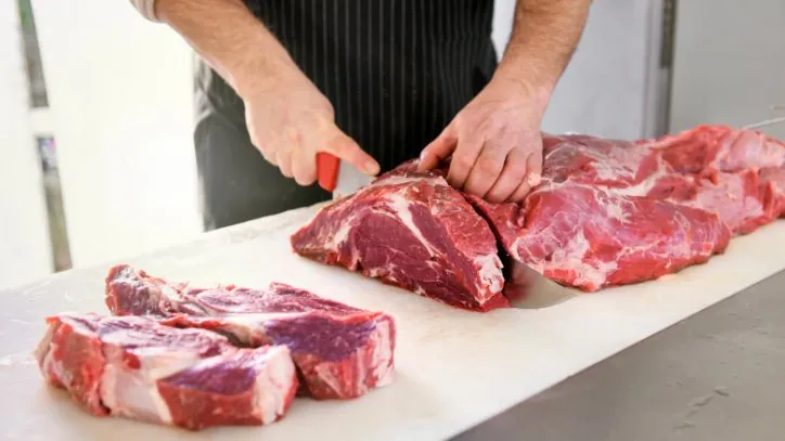 Red meat being cut up