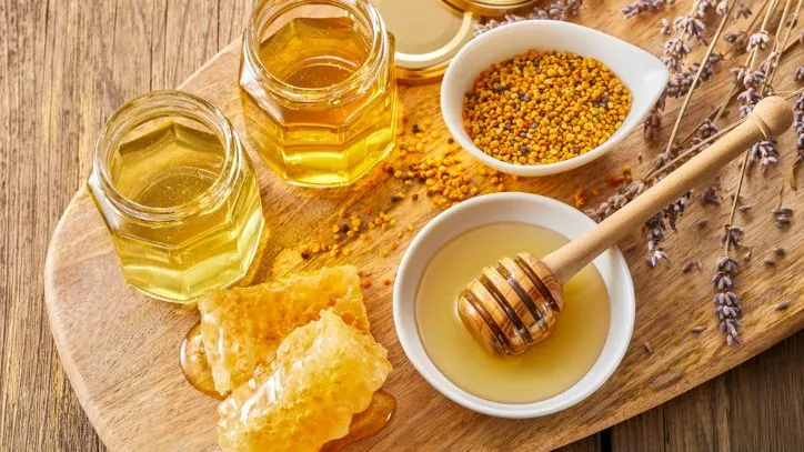 Several jars and bowls of raw honey