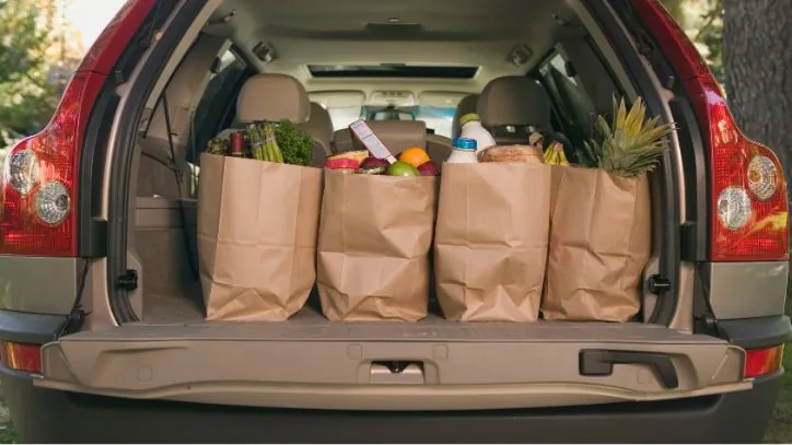Back of an SUV filled with grocery bags