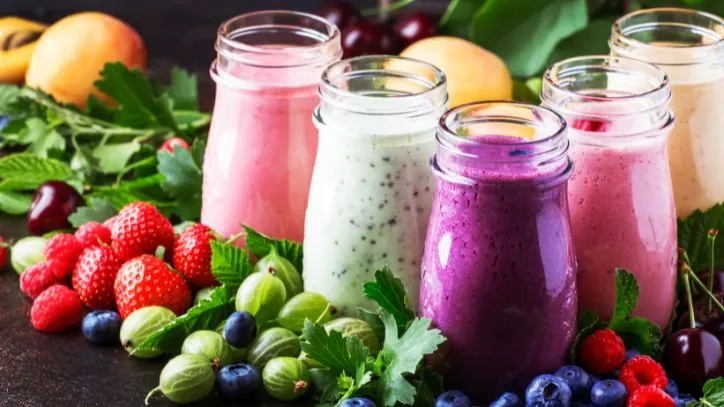 Jars filled with 5 different types of healthy smoothies