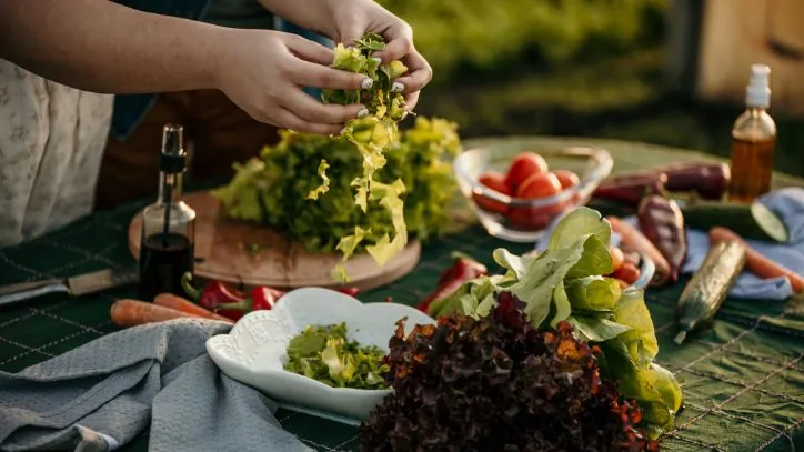 SHredding lettuce to add to a salad