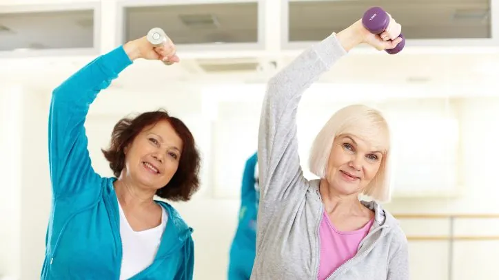 Pair of women working out together