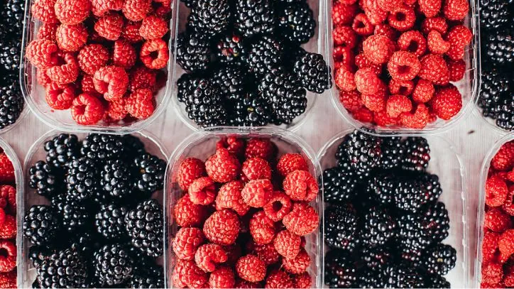 cartons of blackberries and raspberries