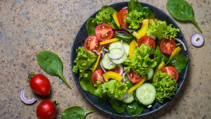 Salad on a plate made with winter greens grown in Yuma AZ