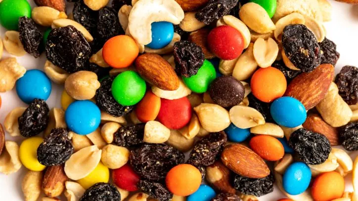 trail mix filled with candy scattered on a counter