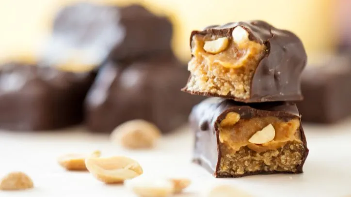 Close up of a Snickers bar cut into pieces